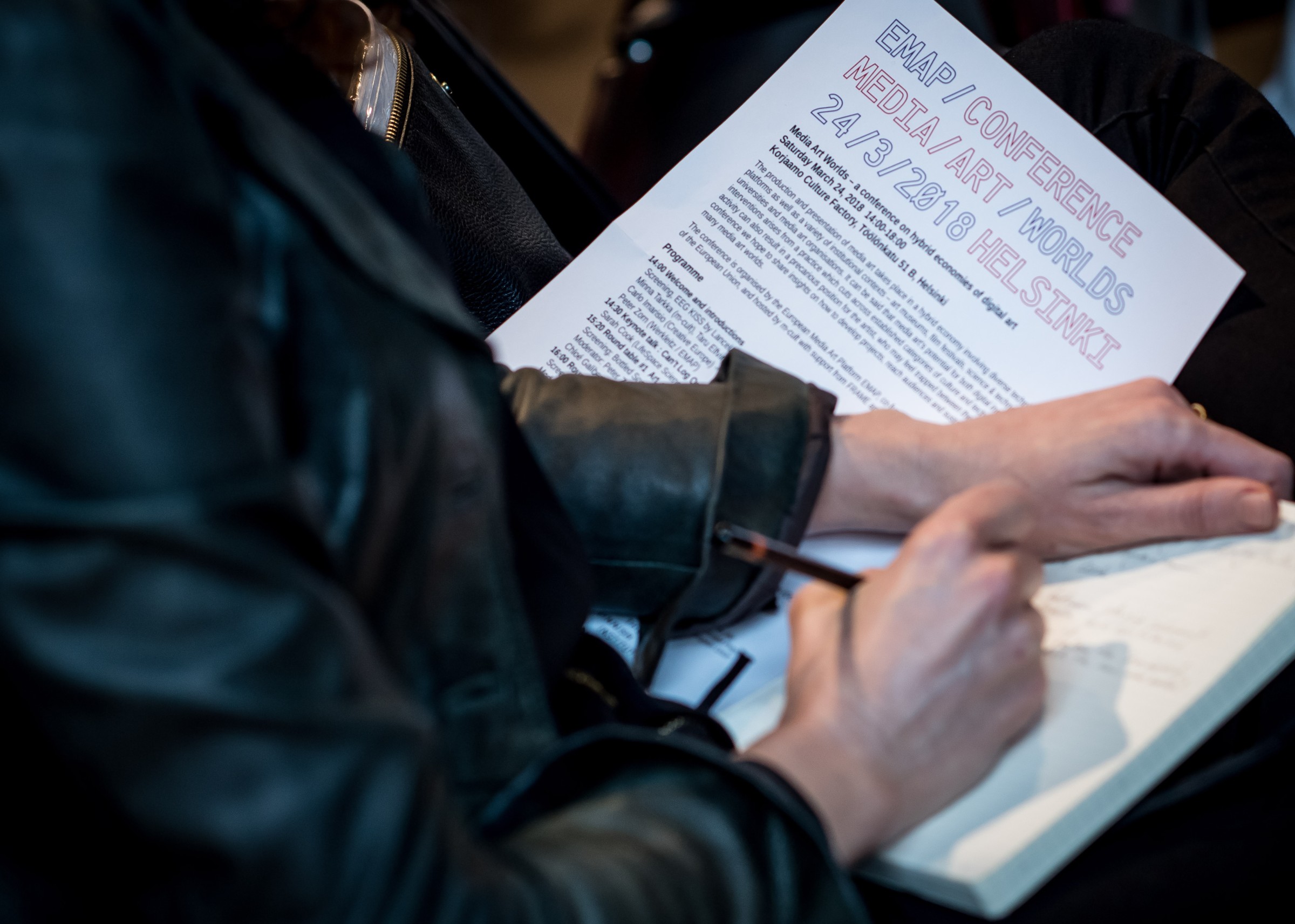 Media Art Worlds Conference - participant taking notes