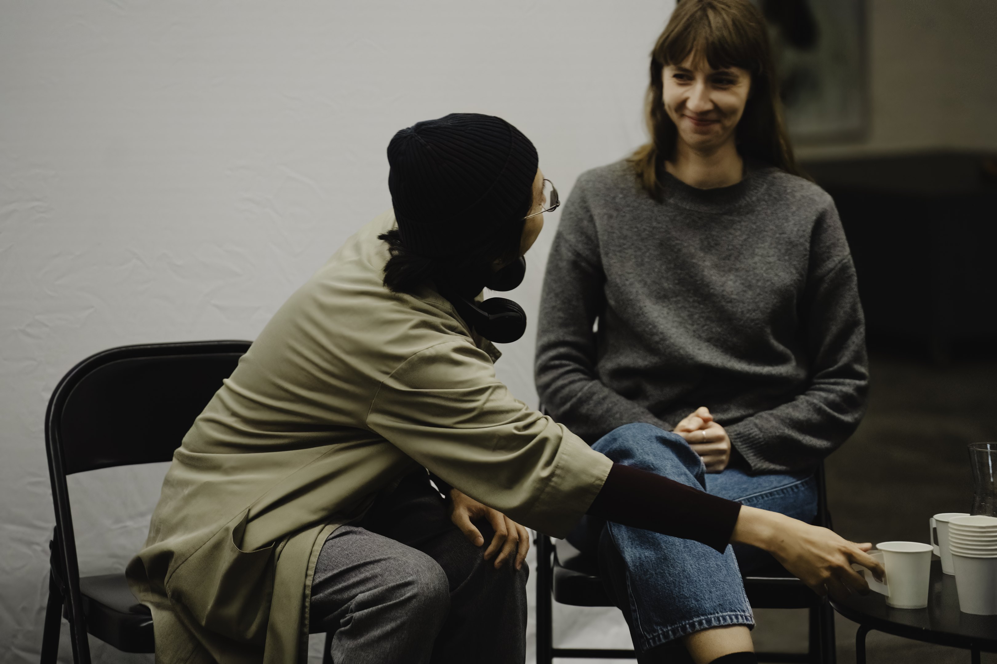 Two people sitting and talking. 
