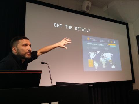 Marek Tuszynski talks, world map on screen