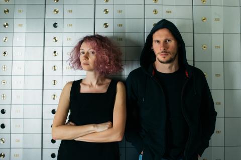 eeefff artists Dzina Zhuk and Nicolay Spesitsev in front of bank vault